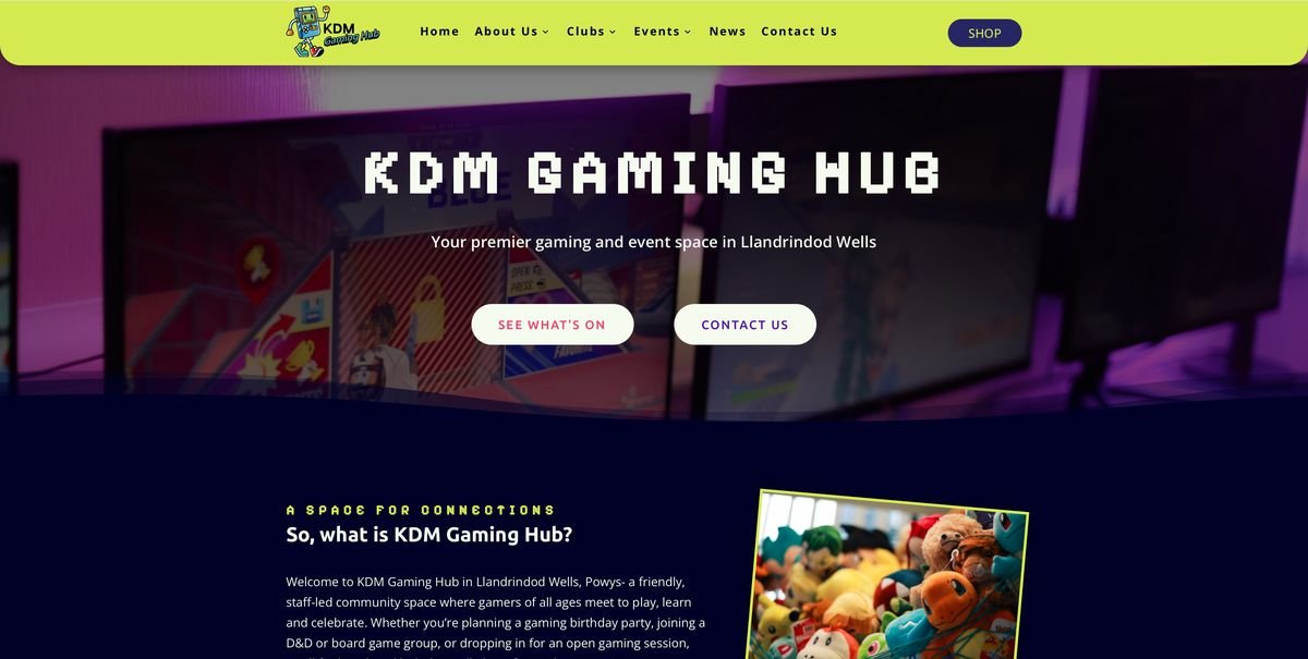 The KDM Gaming Hub homepage, with a pixel-style heading over a photo of gaming screens